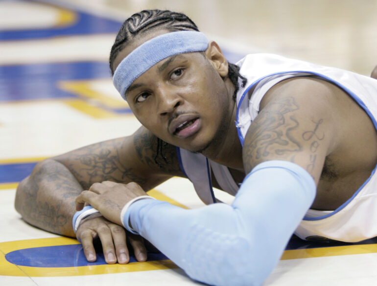 Denver Nuggets forward Carmelo Anthony looks up from the floor after getting called for a foul in the fourth quarter of game 3 of the NBA Western Conference playoff series against the San Antonio Spurs in Denver on April 28, 2007. Anthony, who led Syracuse to an NCAA championship in his lone college season and went on to spend 19 years in the NBA, announced his retirement on Monday, May 22, 2023. David Zalubowski/AP