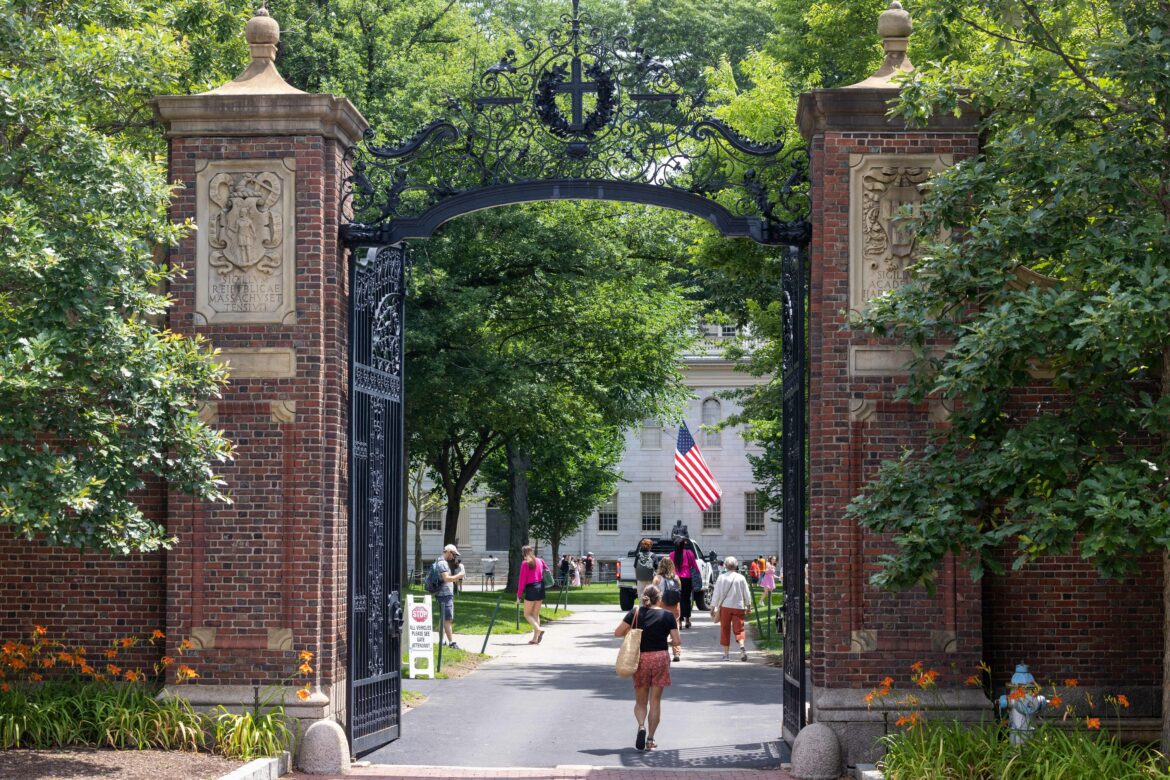 CAMBRIDGE, MASSACHUSETTS - JUNE 29: People walk through the gate on Harvard Yard at the Harvard University campus on June 29, 2023 in Cambridge, Massachusetts. Scott Eisen/Getty Images