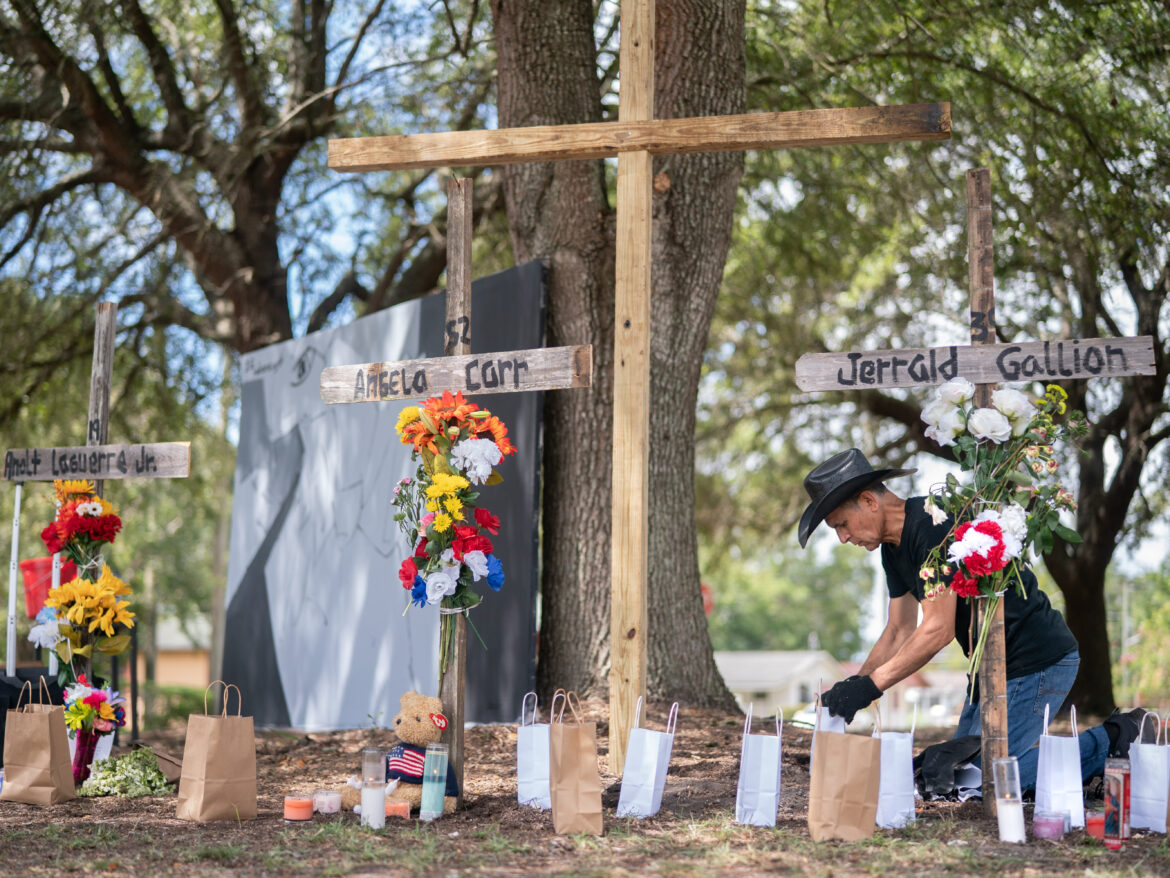 Texas based artist Robert Marquez works on memorials for Jerrald Gallion, Angela Carr and Anolt Joseph Laguerre Jr. near a Dollar General store where the were shot and killed two days earlier on August 28, 2023 in Jacksonville, Florida. Sean Rayford/Getty Images