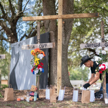 Texas based artist Robert Marquez works on memorials for Jerrald Gallion, Angela Carr and Anolt Joseph Laguerre Jr. near a Dollar General store where the were shot and killed two days earlier on August 28, 2023 in Jacksonville, Florida. Sean Rayford/Getty Images