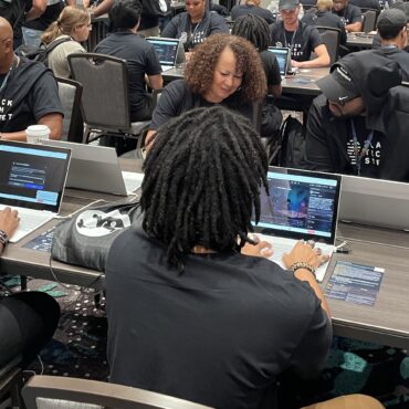 Marvin Jones (left) and Rose Washington-Jones (center), from Tulsa, Okla., took part in the AI red-teaming challenge at Def Con earlier this month with Black Tech Street. Deepa Shivaram/NPR