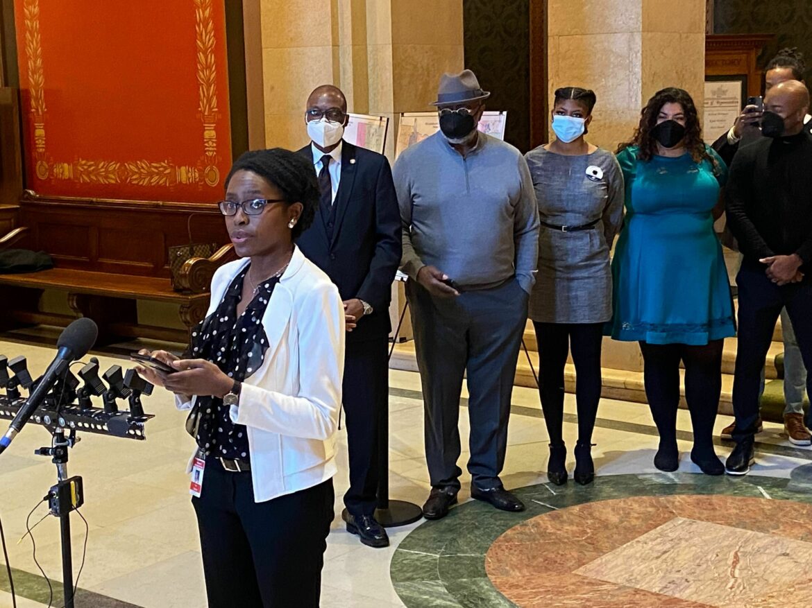 In Minnesota, the CROWN Act, an acronym meaning "Creating a Respectful and Open World for Natural Hair," adds hairstyle and texture to a provision in the Minnesota Human Rights Act that prohibits racial discrimination in housing, employment and education, among other areas. Here, Rep. Esther Agbaje, D-Minneapolis, speaks to reporters outside of the House chamber in St. Paul on Feb. 28, 2022.
Mohamed Ibrahim/AP