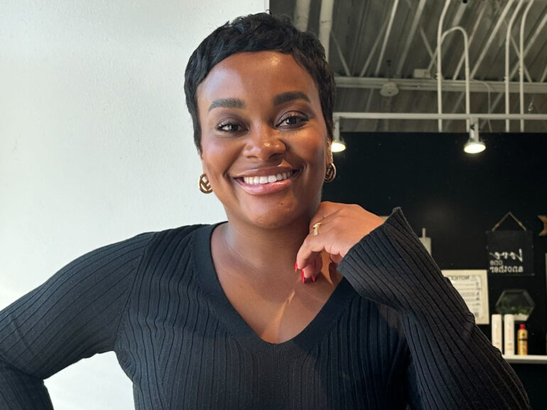 Kayleigh Butler, a hair stylist, stands for a portrait at her studio in Atlanta on Tuesday, Oct. 17, 2023. "Relaxers have taken an extreme decline ... as we became more knowledgeable about the effects of the relaxer on your hair and what it can do to your hair," says Butler, who remembers getting relaxers when she was 5 years old. Kenya Hunter/AP