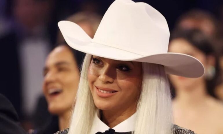 Beyoncé watches Jay-Z as he accepts the Dr. Dre Global Impact Award during the 66th Grammy Awards on Feb. 4. Kevin Mazur/Getty Images for The Recording Academy