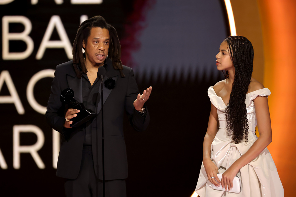Jay-Z (left) accepts the honorary Dr. Dre Global Impact Award alongside his daughter, Blue Ivy Carter, during the 66th Grammy Awards on Sunday, Feb. 4, 2024, in Los Angeles. Kevin Winter/Getty Images for The Recording Academy