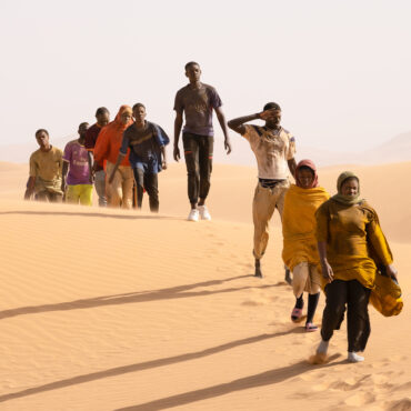 Seydou (Seydou Sarr, in gray) crosses the desert in Io Capitano. Greta De Lazzaris/Cohen Media Group
