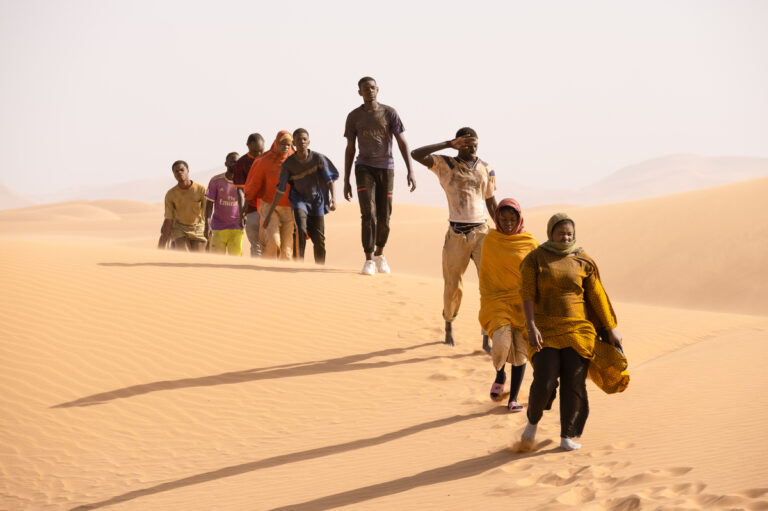 Seydou (Seydou Sarr, in gray) crosses the desert in Io Capitano. Greta De Lazzaris/Cohen Media Group