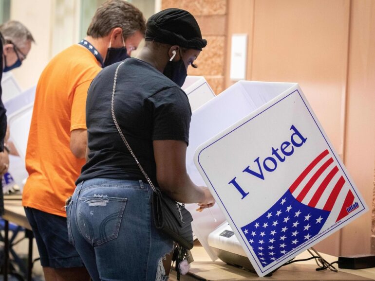 Voters cast their ballots in North Charleston, S.C., on Oct. 16, 2020. A new study says the turnout gap between white and nonwhite voters in the U.S. is growing fastest in jurisdictions that were stripped of a federal voting protection by a Supreme Court decision. Logan Cyrus/AFP via Getty Images