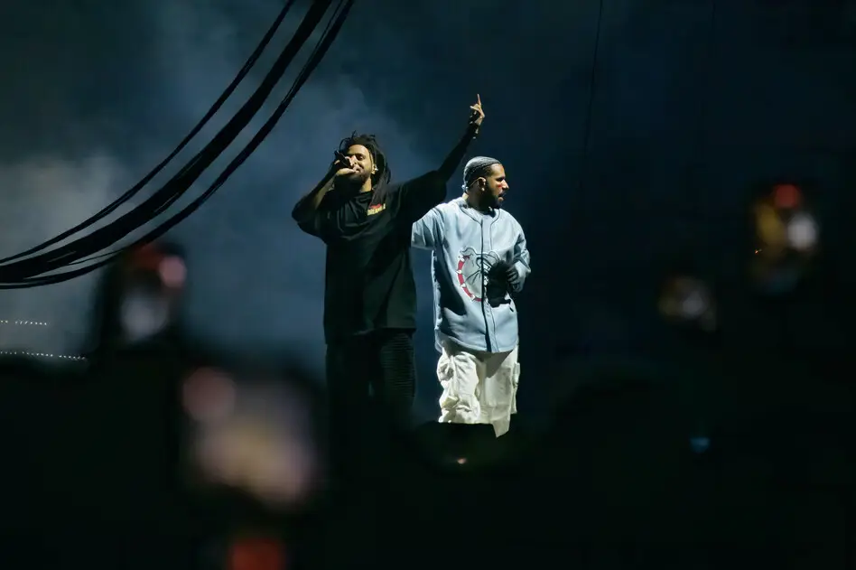 J. Cole and Drake perform during the 2023 edition of Cole's Dreamville festival in Raleigh, N.C., last April. Their collaborative track "First Person Shooter" recently touched off a war of words with fellow MC Kendrick Lamar. Astrida Valigorsky/WireImage/Getty Images