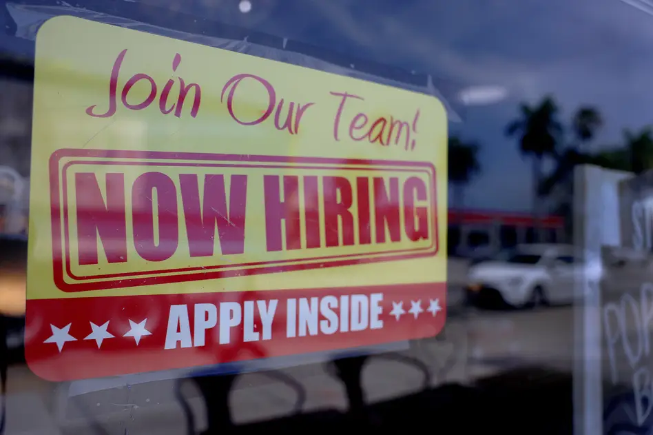 A sign seeking job applicants is seen in the window of a restaurant in Miami, Florida, on May 5, 2023. Joe Raedle/Getty Images