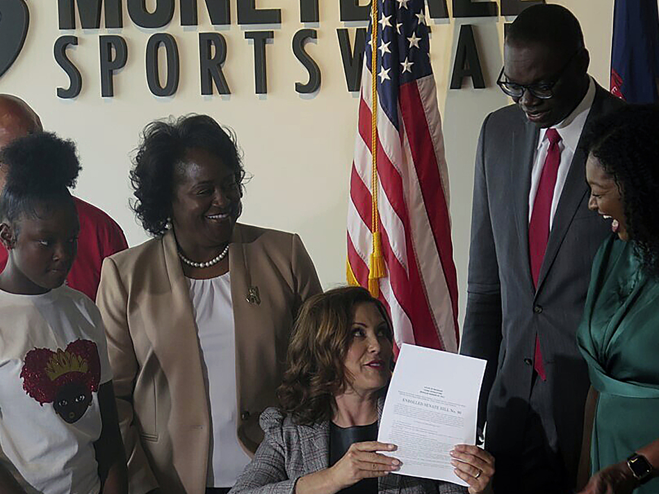 A number of Democratic lawmakers have reintroduced the CROWN Act, legislation that would ban discrimination based on one's hairstyle or hair texture. Here, Michigan Gov. Gretchen Whitmer signs Crown Act legislation on June 15, 2023 in Lansing, Mich. that will outlaw race-based hairstyle discrimination in workplaces and schools. Joey Cappelletti/AP