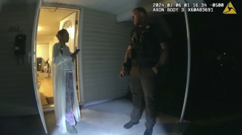 In this image taken from body camera video released by Illinois State Police, Sonya Massey, left, talks with former Sangamon County Sheriff’s Deputy Sean Grayson outside her home in Springfield, Ill., July 6, 2024. AP/Illinois State Police