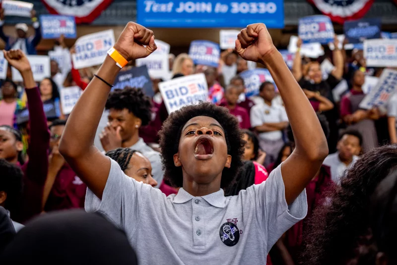 A member of the audience cheers as President Biden speaks during a campaign rally at Girard College on May 29 in Philadelphia. Biden has since dropped out of the race in favor of Vice President Harris and this event launched a nationwide campaign to court Black voters, a group that has traditionally come out in favor of Biden, but their support projected lower for him than it was in 2020. Harris' stake with the group is yet to be seen. Andrew Harnik/Getty Images