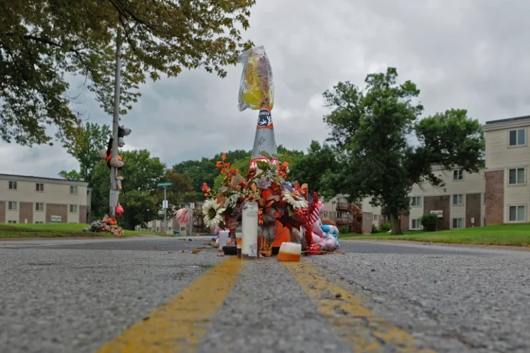 A makeshift memorial for Michael Brown stands in the street on Sept. 11, 2015, in Ferguson, Mo. Brown's death prompted nationwide protests and a White House report on American policing. Michael B. Thomas/Getty Images