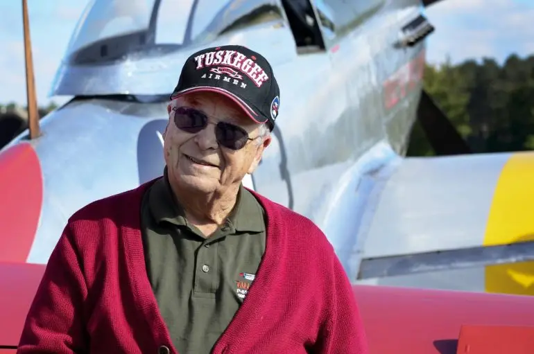 U.S. Air Force retired Lt. Col. George E. Hardy, a Tuskegee Airman, stands next to his former P-51D Mustang at Royal Air Force Lakenheath, England, Oct. 4, 2016.